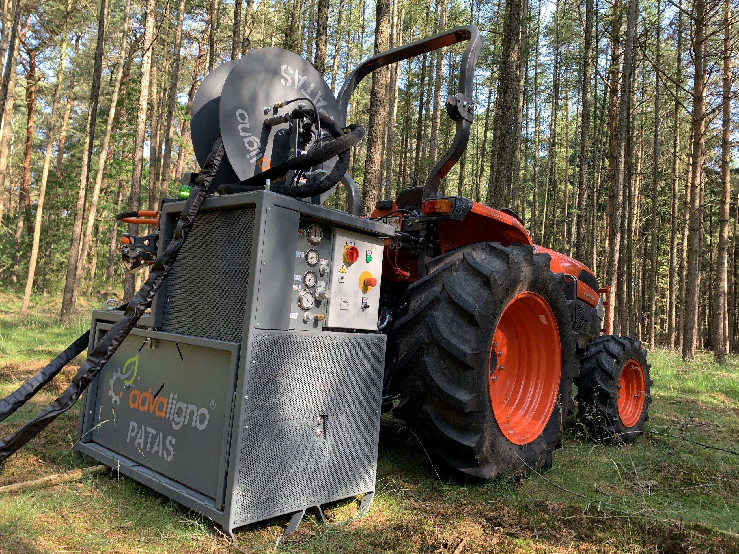 PATAS machine mounted on tractor in forest
